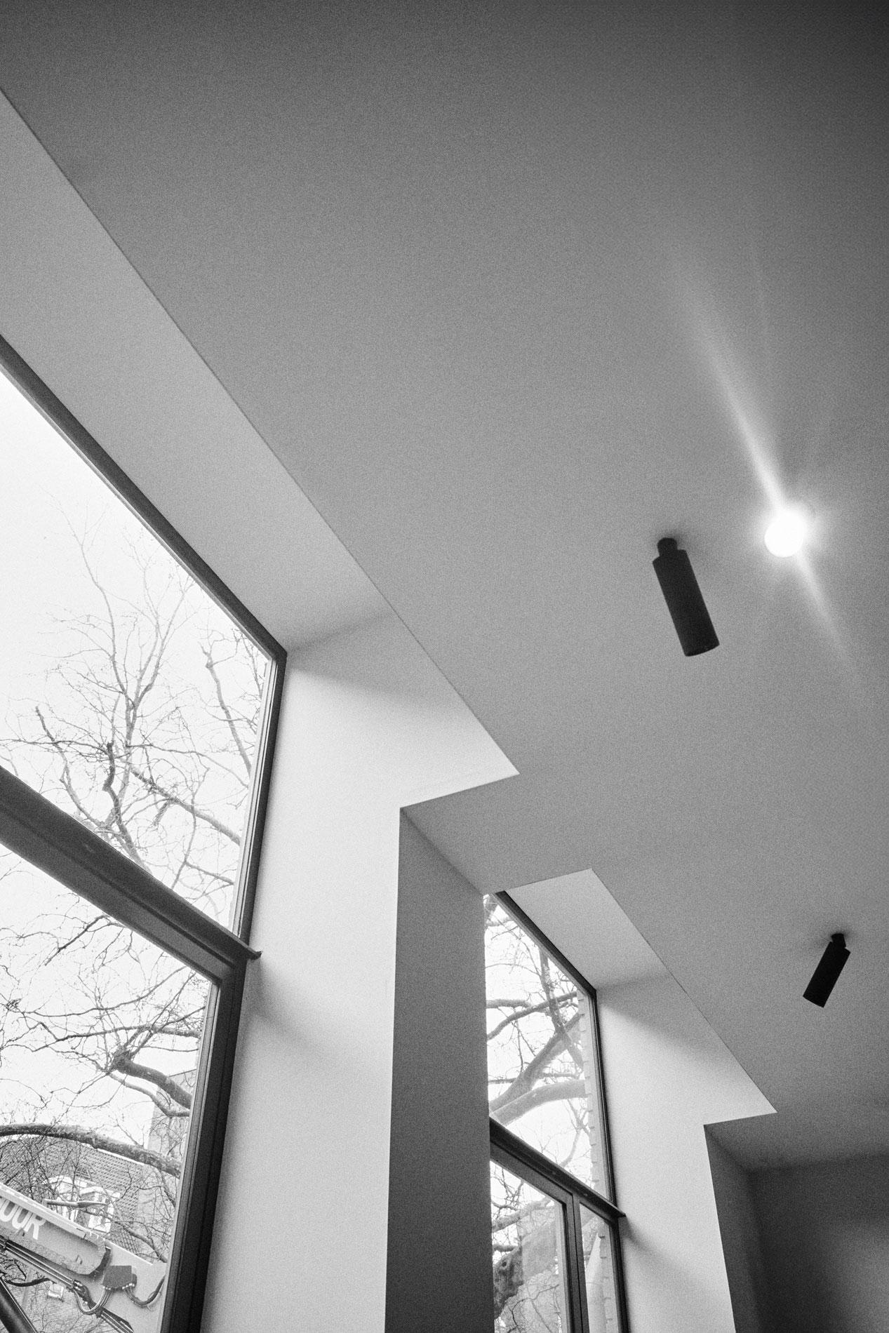 Modern ceiling finished with Acosorb's acoustic solution in a restaurant interior